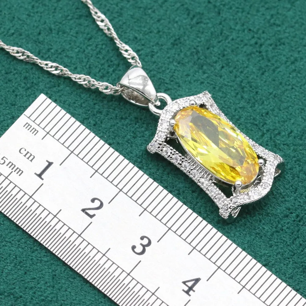 Women's anti-allergy zircon jewellery set in yellow with necklace, earrings, ring, and bracelet on display.