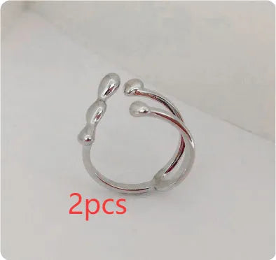 Brass opening ring with spherical elements in gold or silver finish, adjustable women's fashion jewellery