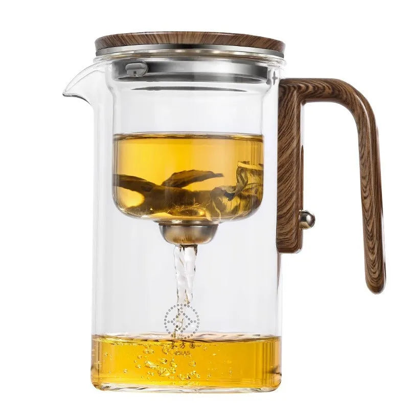 Glass teapot with magnetic tea leaf separator and wooden handle shown in new Chinese style.