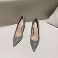 Women's silver and black stiletto wedding shoes with crystal detail on a 9cm heel.