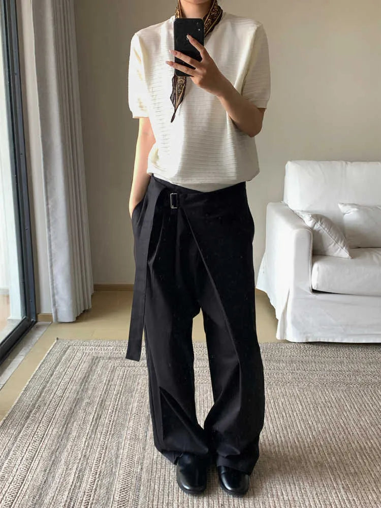 Black loose fit straight-leg trousers with single pleat front and adjustable waistband