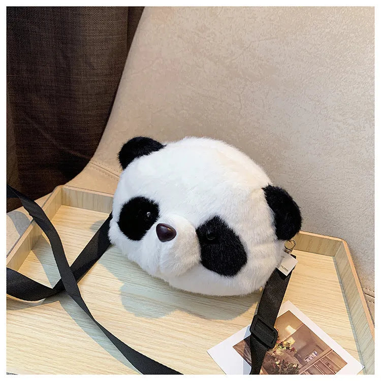 Soft plush panda head cylindrical crossbody bag with an outer sandwich pocket.