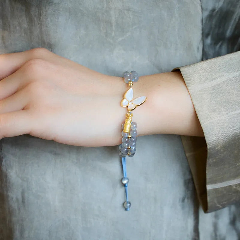 Gray moonstone woven bracelet with geometric design on woven hand rope