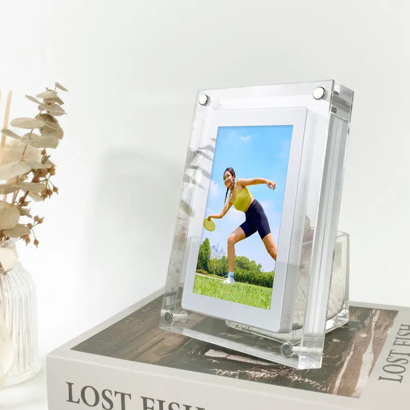 White acrylic digital picture frame with 5 inch vertical screen on a table