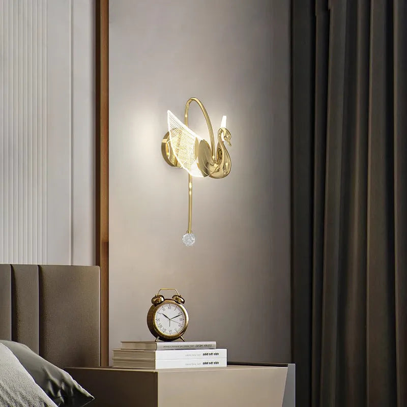 Gold minimalist swan silhouette wall lamp with acrylic shade and dimmable LED light.