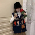 Loose-fit women's sleeveless cardigan top in a diamond plaid pattern, shown in khaki colour.