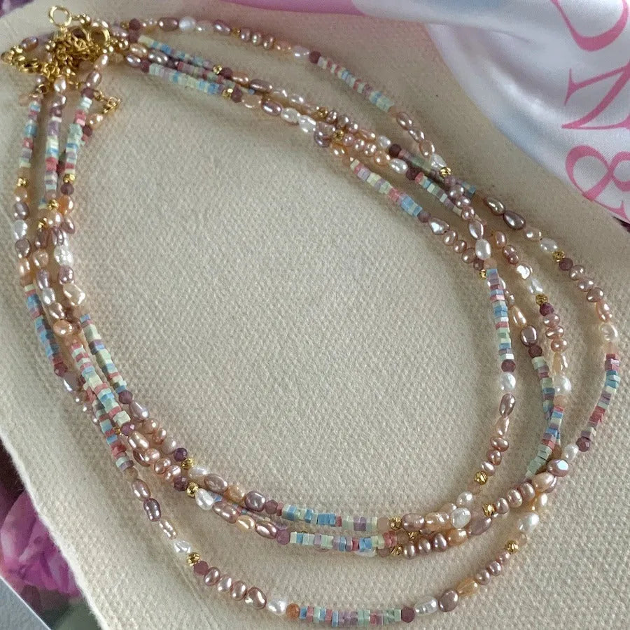 Natural irregular pearl bracelet and necklace set in 14k gilded purple silver tone.