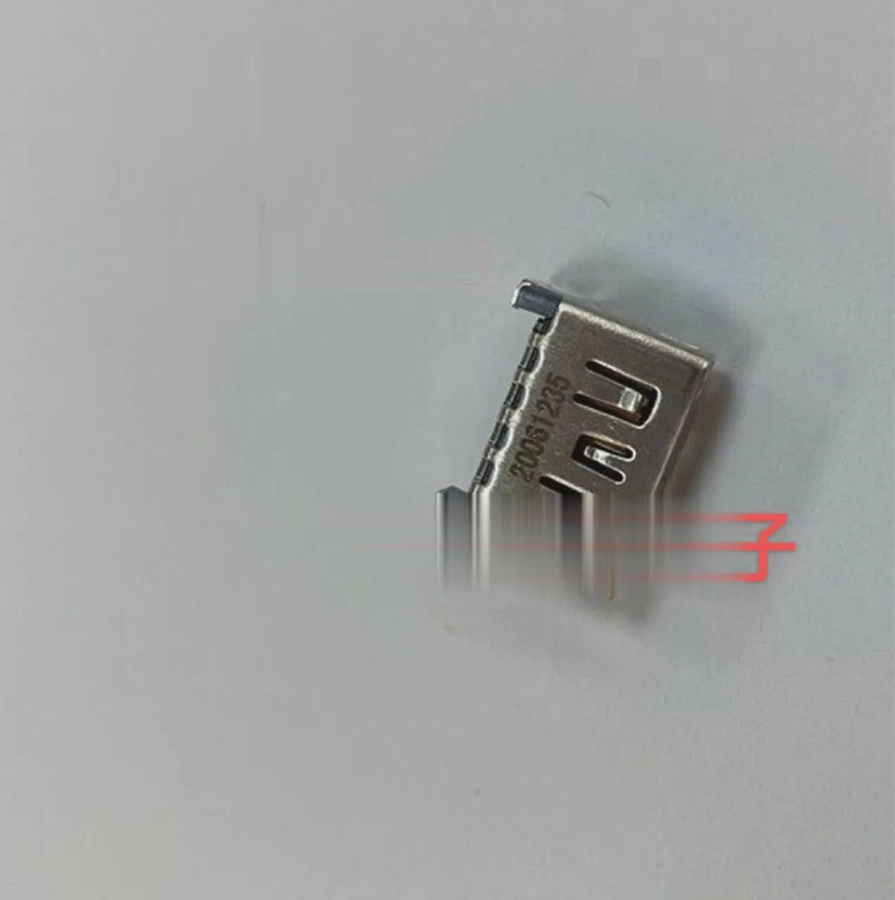 Silver HDMI host interface socket for game console repair and signal connectivity.