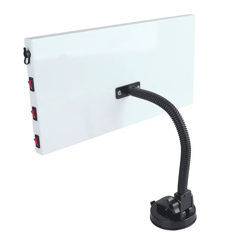 White MPT X009 car body dent repair detector kit with inspection light and magnetic base on a vehicle panel.