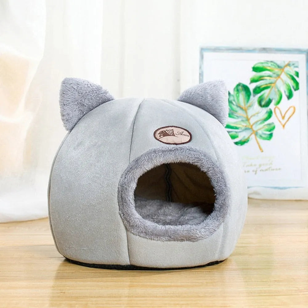 Large grey enclosed sofa-style winter nest cat bed for indoor cats, showing removable fleece lining.