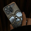 Frosted skull TPU phone case in matte black for iPhone 14 Pro showing hollow skull design