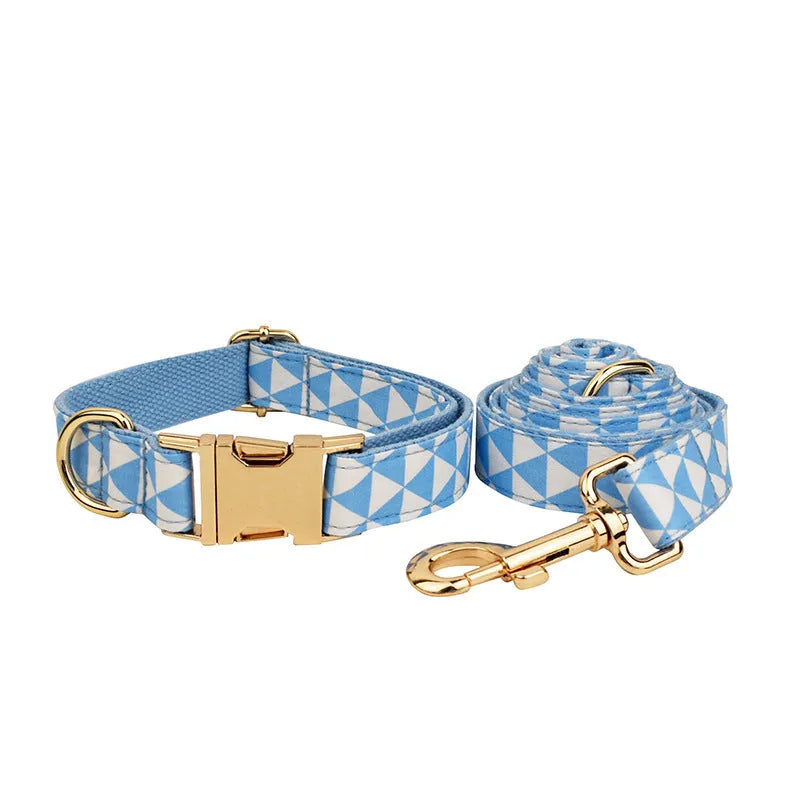 Blue cloth dog collar, leash, vest, and bow set with triangular ring rope design on a white background.