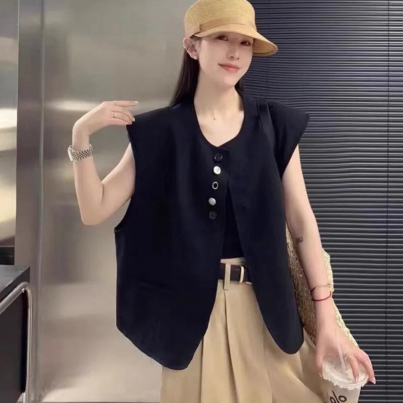 Women's loose fit solid colour polyester vest with pockets in milk white.