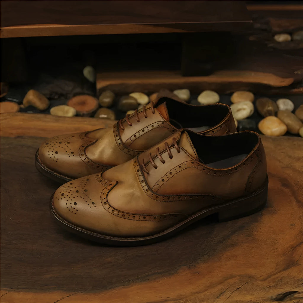 Men's light brown distressed leather lace-up shoes with hand-carved vintage detailing