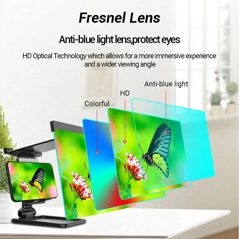 Black folding mobile phone screen magnifier with detachable holder on a desk.