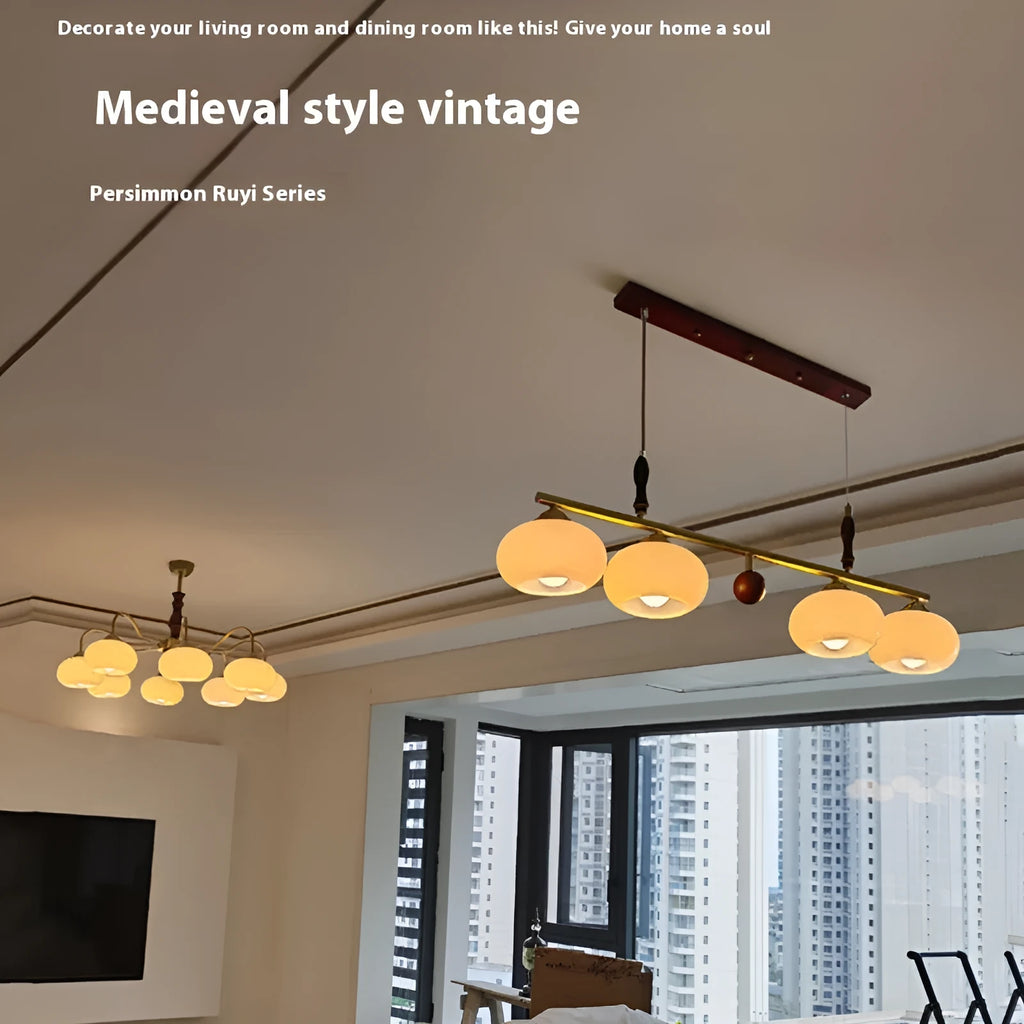 American retro persimmon chandelier with amber yellow glass shades in a dining room setting