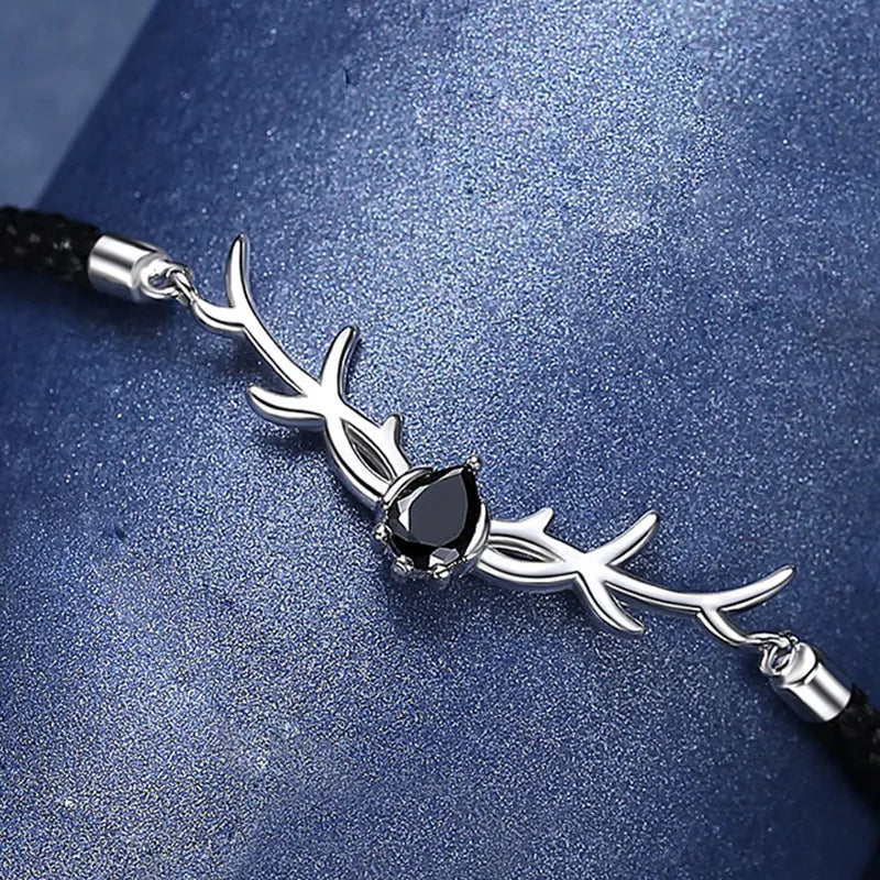 Yi Lu Has You braided rope bracelet in copper with animal zodiac design on display