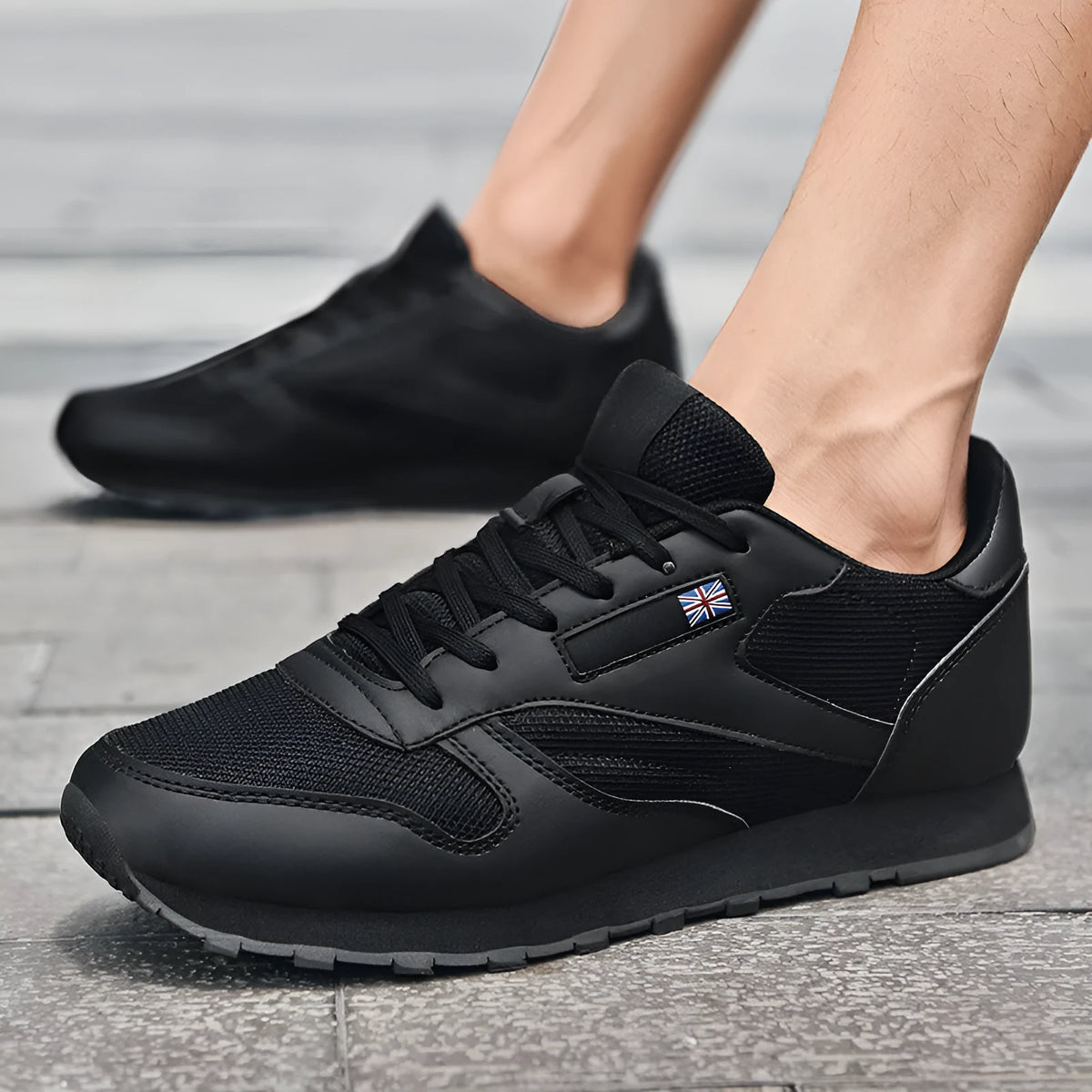 Men's lightweight running shoes black nylon leather upper with mesh lining and MD sole on gym floor