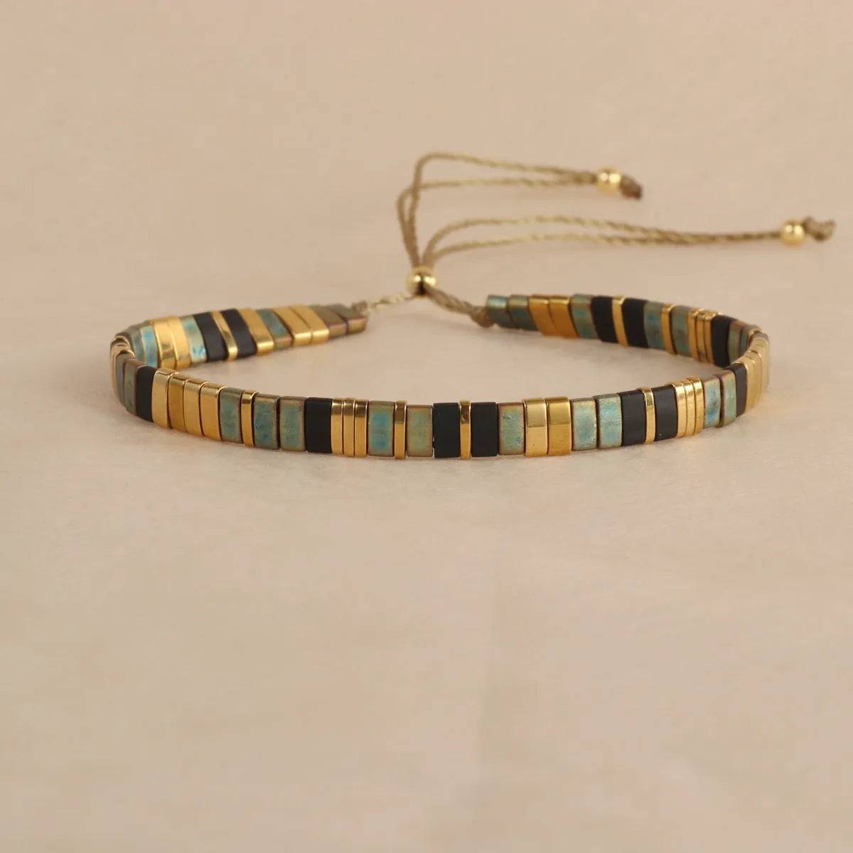 Geometric glass beaded bracelet in five colour options with pull beads adjustment