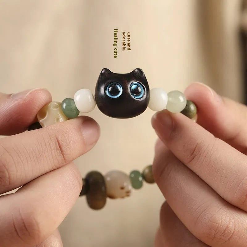 Hand-woven bracelet with sugar cat's paw design combining bodhi seed, jade and ebony wood
