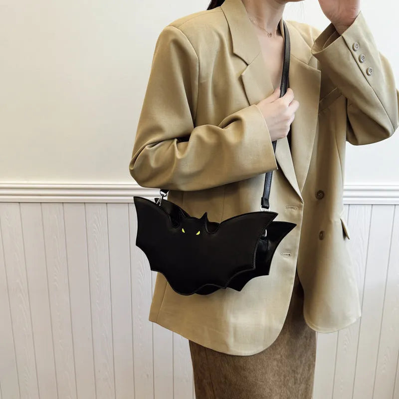 Black PU Halloween bat shaped shoulder messenger bag with crossbody strap on white background