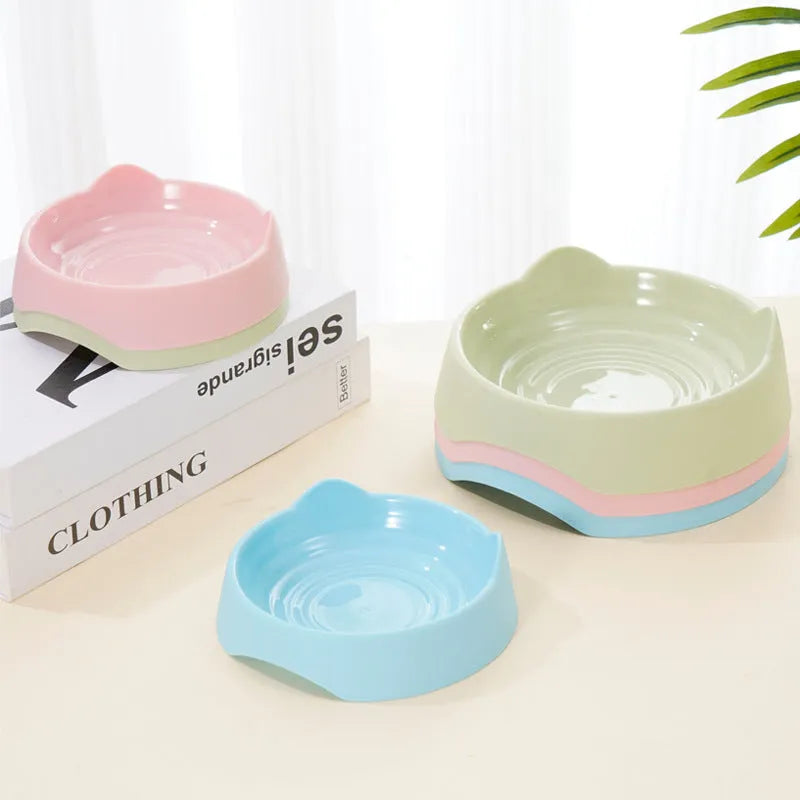 Ceramic dog slow feeder puzzle bowl in blue, green, or pink colours shown in two size options