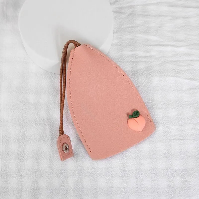 Cartoon pull-out key case in PU leather measuring 14 x 7.5 cm with colourful designs