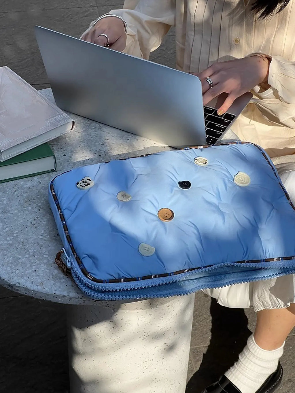 Blue and citrus hug plaid patterned nylon laptop protective case for 14-inch and 16-inch computers.
