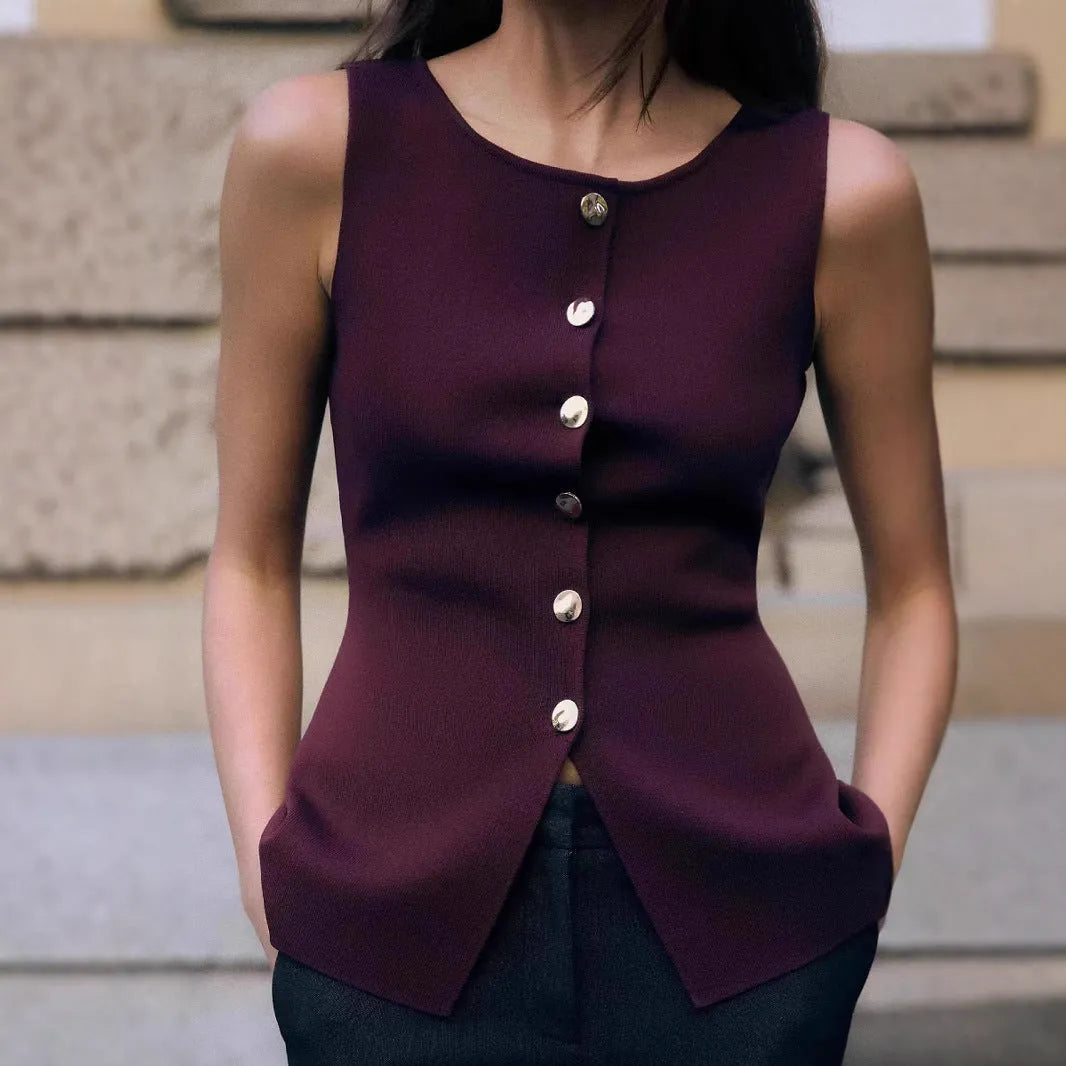 Dark red slim-fit sleeveless cardigan vest with a raised 3D pattern texture on a mannequin.