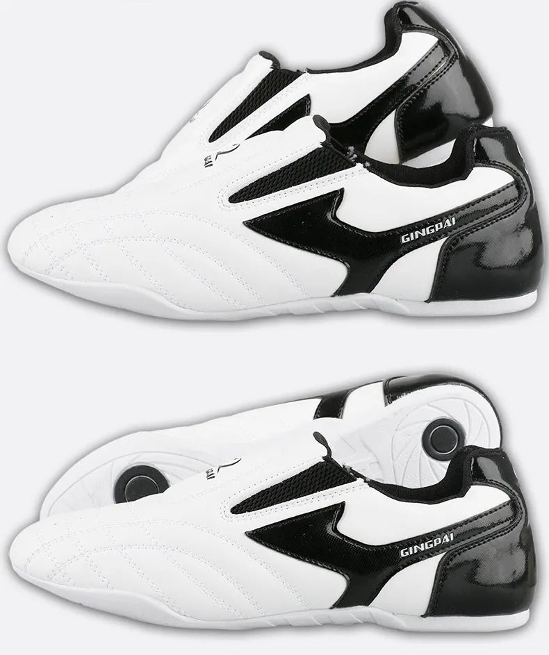 Black and white children's Sanda Taekwondo martial arts shoes with a soft sole and widened fit.