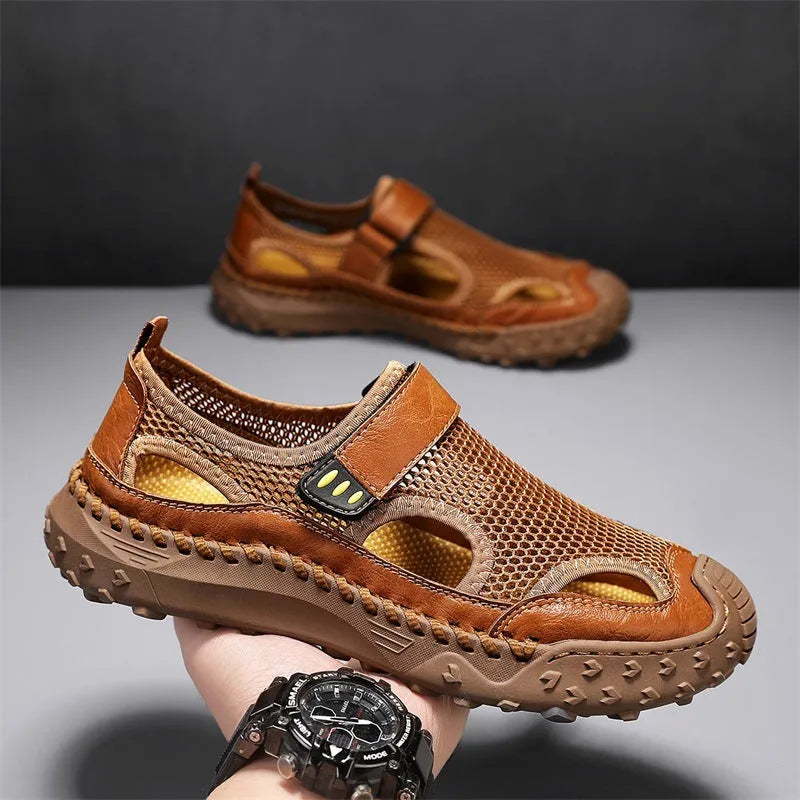 Men's black casual sandals showing breathable mesh upper and Velcro strap closure.