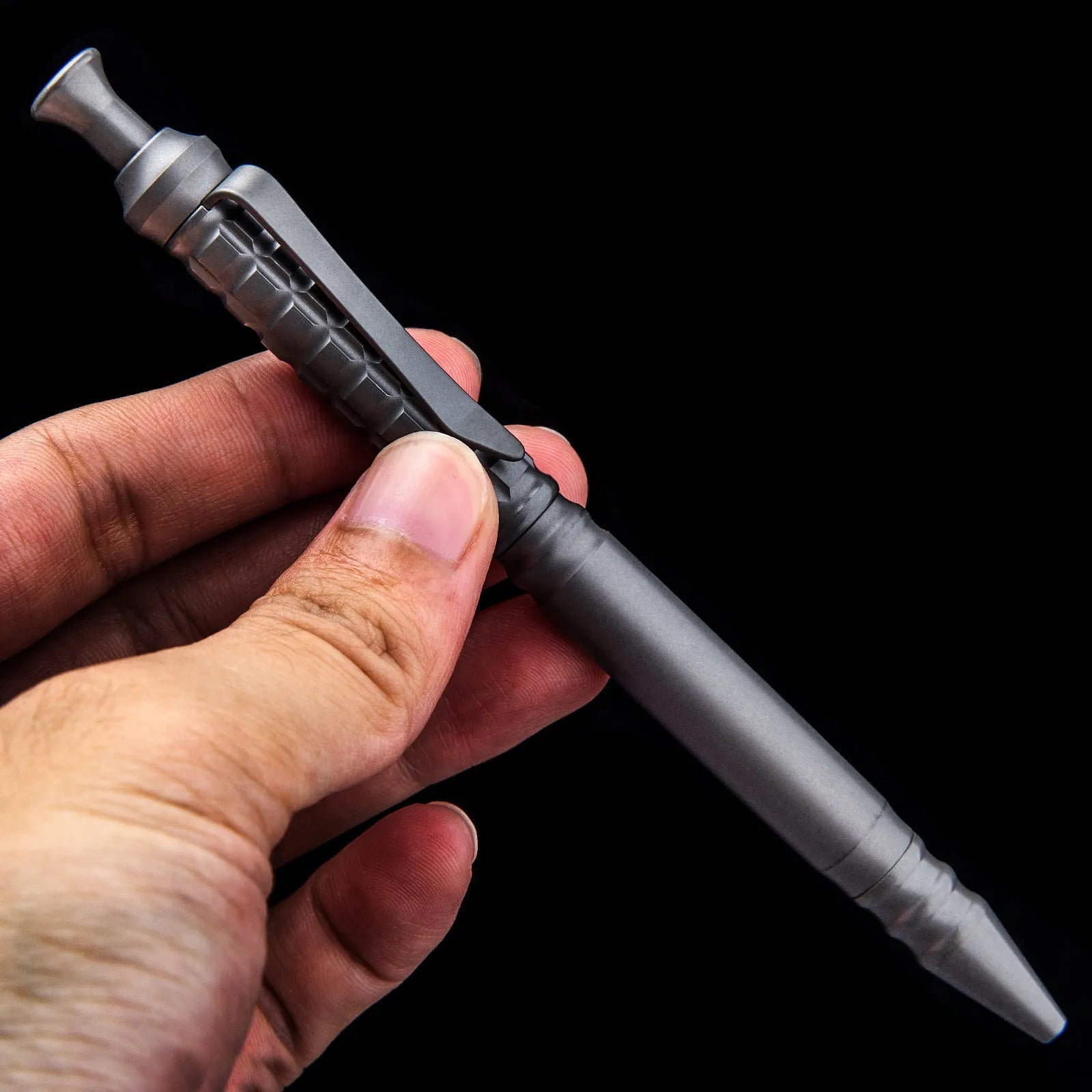Gunmetal grey titanium tactical pen with push-action mechanism and 0.5mm nib