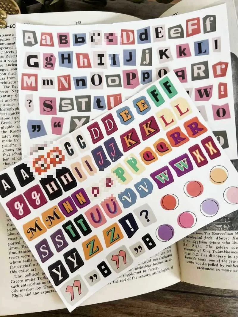 Set of cute style printed decoration stickers showing English letters, numbers, symbols, and weekly words.