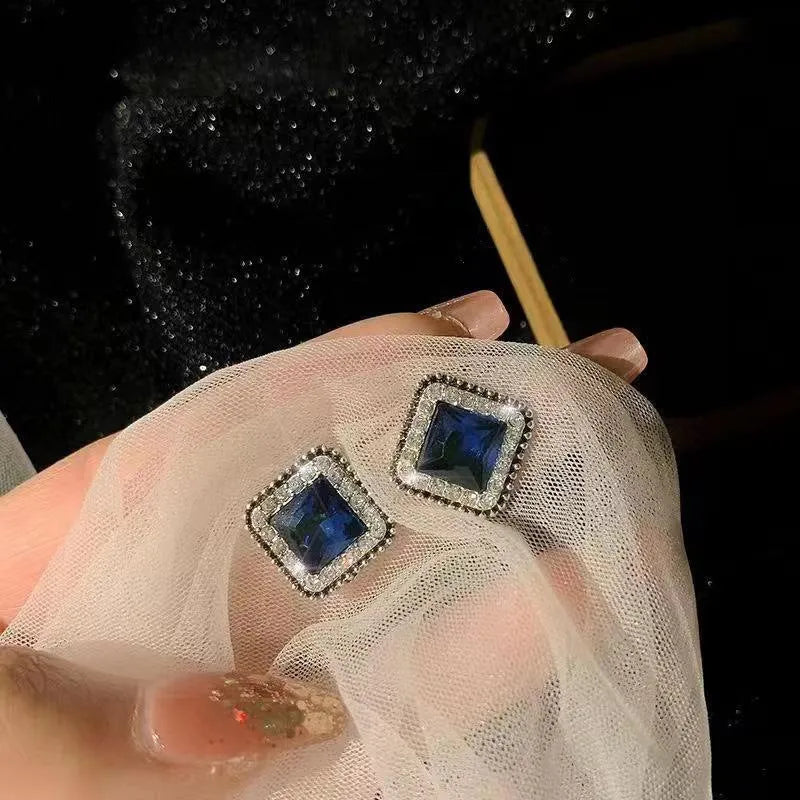 Close up of Korean blue diamond square earrings with geometric zinc alloy design for women