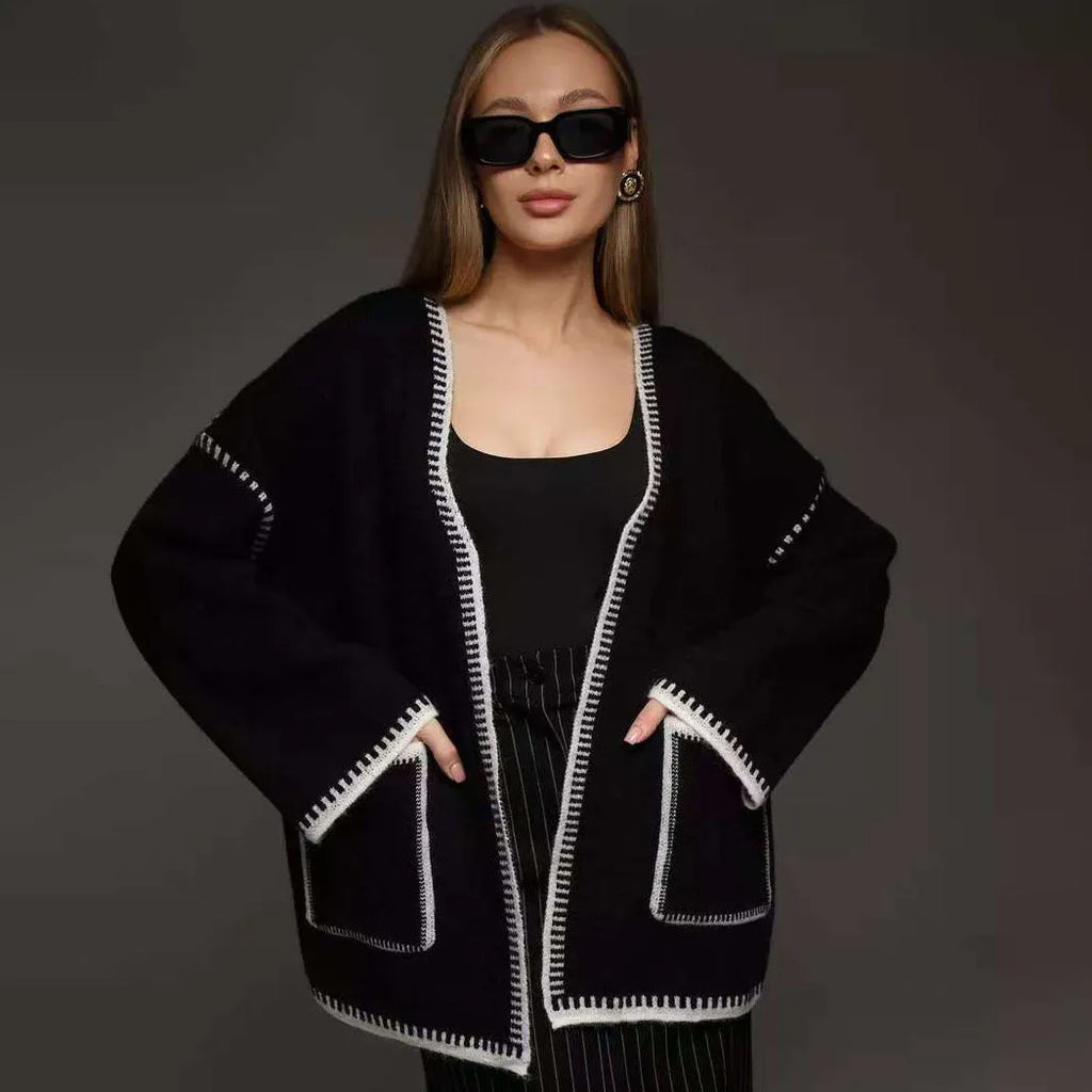 Loose mid-length knitted cardigan with lace-up front, in white, black, or camel.