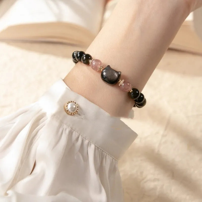 Black obsidian bracelet with 8mm stones and kitty charms on adjustable cord