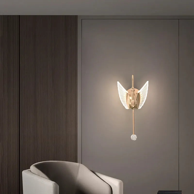 Gold minimalist swan silhouette wall lamp with acrylic shade and dimmable LED light.