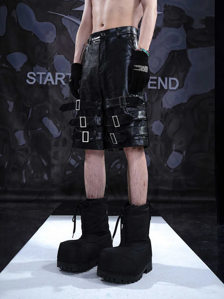 Men's black PU leather casual shorts with metal ring detail on a medium-low waistband.