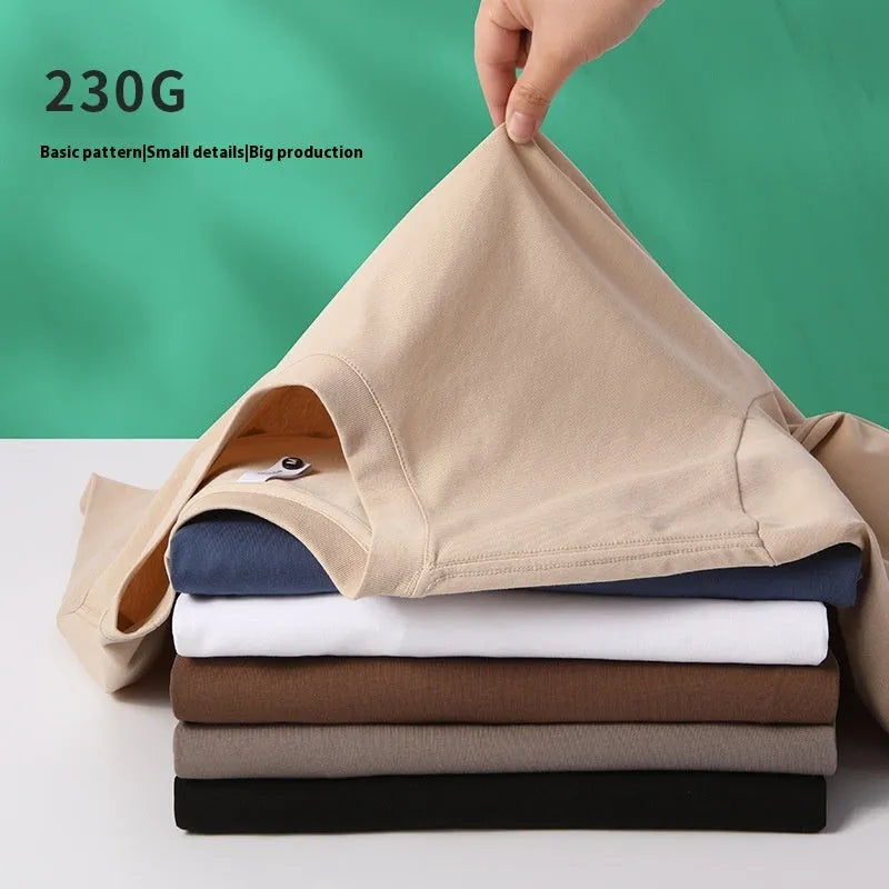 Heavy 230g cotton blend drop shoulder t-shirt in a solid colour, showing loose fit and short sleeves.