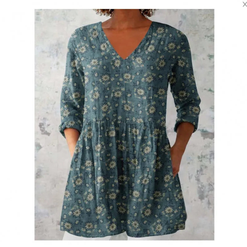 Women's loose-fitting long dress with a blue wave pattern print and 3/4 sleeves.