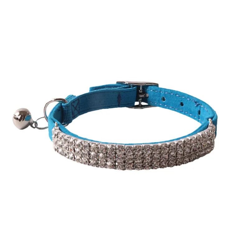 Soft flocked cat collar with an elastic buckle shown in multiple colours.