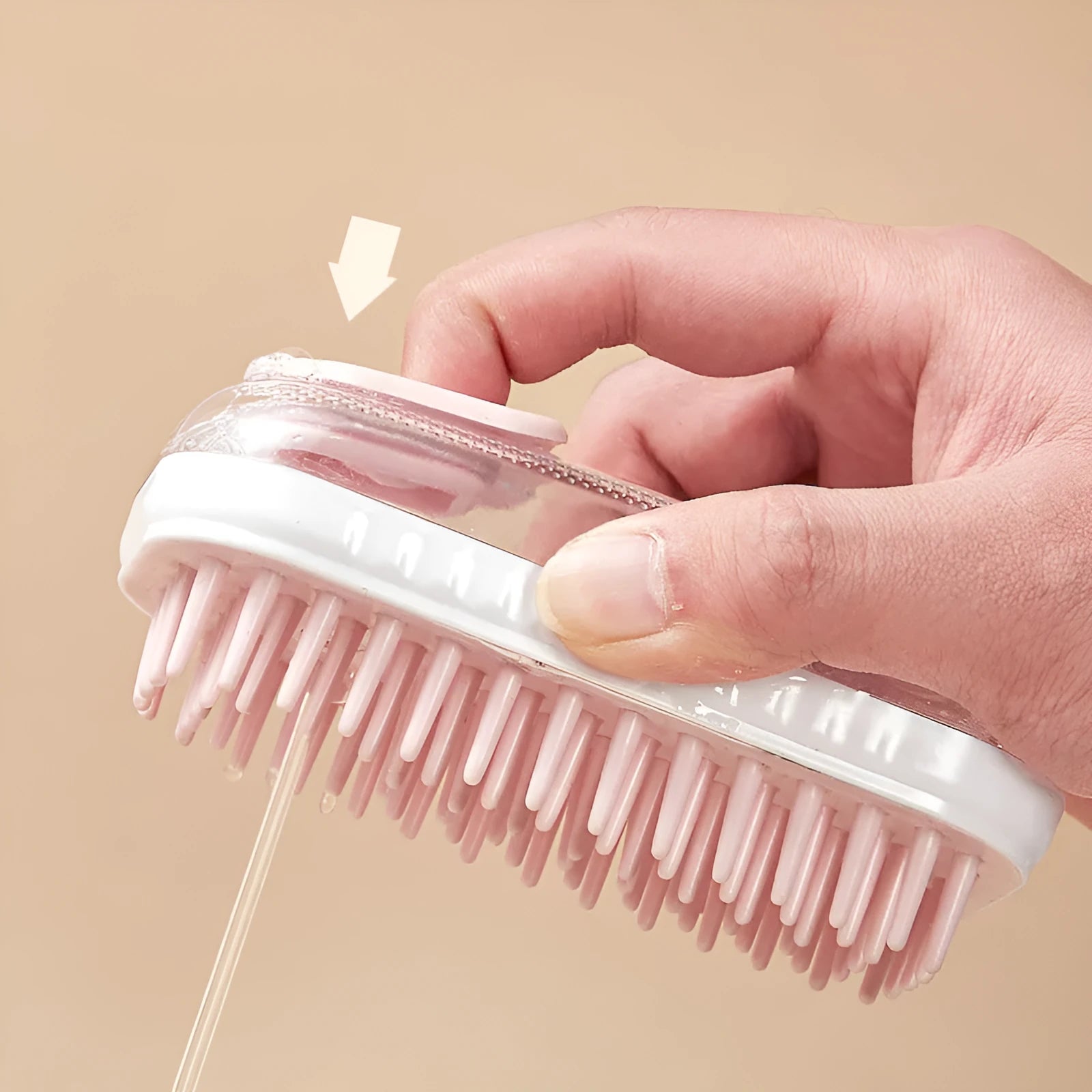 Grey and pink silicone pet bath brush for dogs and cats, handheld with soft bristles.