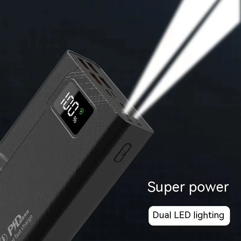 Large capacity black and white power bank with fast charging support showing size scale.