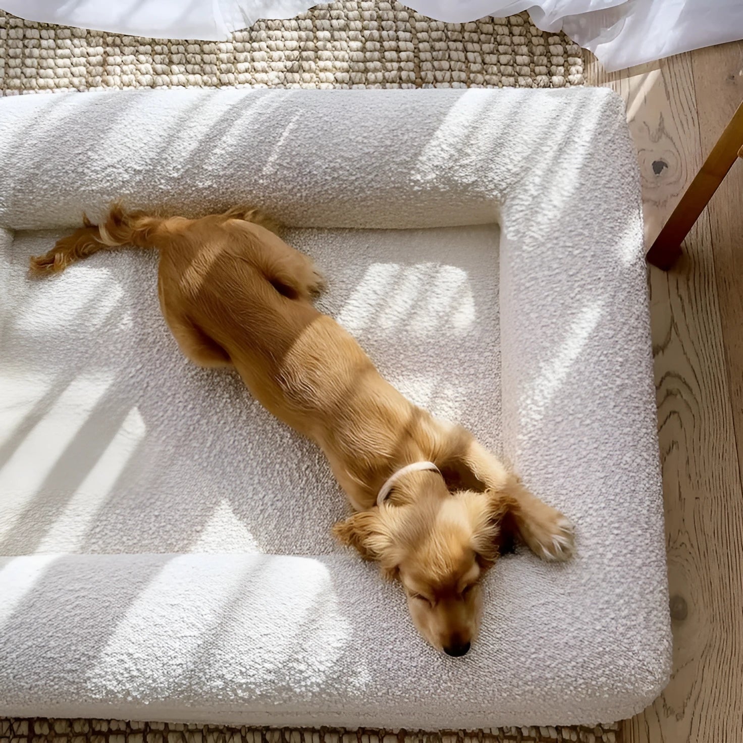 Beige rectangular cloth dog bed sofa nest for pets on a floor