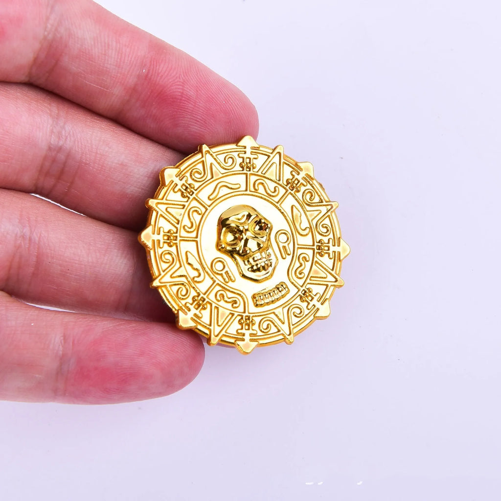 Gold plastic pirate coin with pointed edges measuring 3.6cm diameter for Halloween costumes