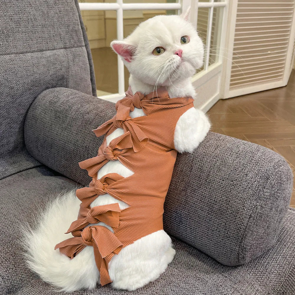 Lace-up polyester cat recovery suit in blue colour shown on a model, size L for cats 6-9kg.
