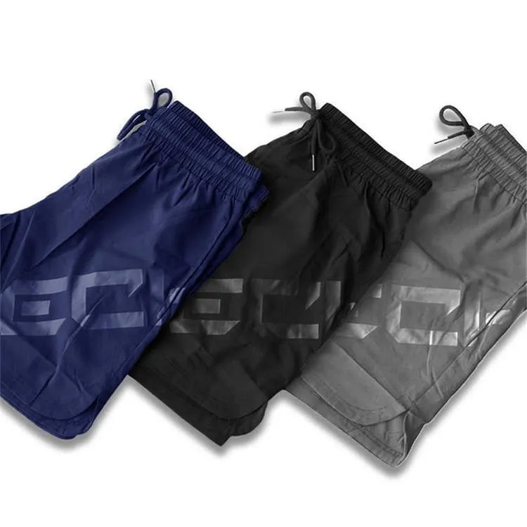 Men's knee-length quick-dry training shorts in nylon fabric for summer running and sports