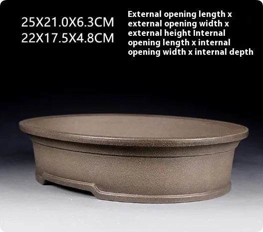 Handmade antique oval bonsai pot in purple sand clay measuring 25x21x6.3 cm