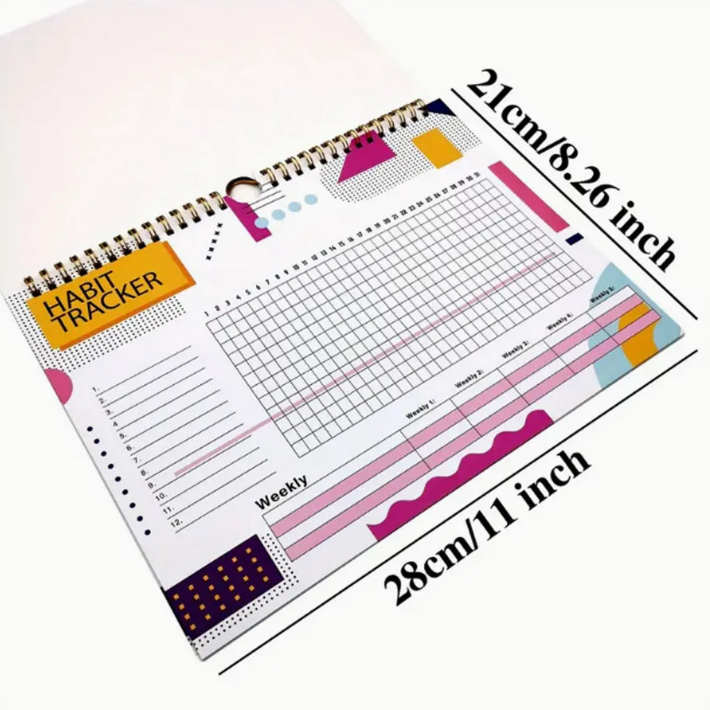 A4 habit tracking book with coloured cover open to show interior pages