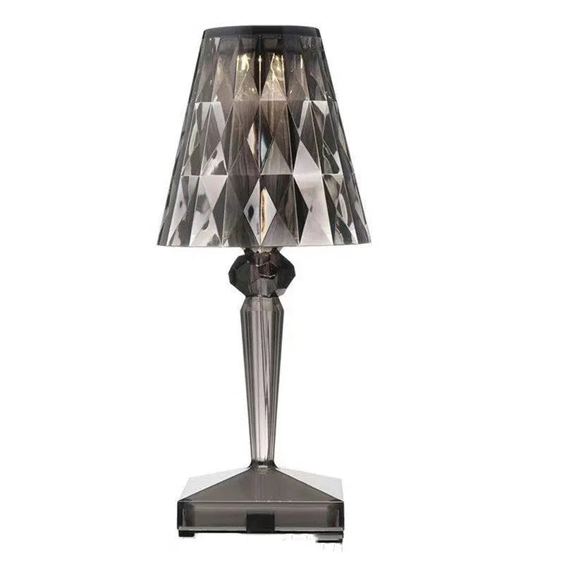 Rose gold portable touch night light with adjustable three-colour lighting on wooden surface